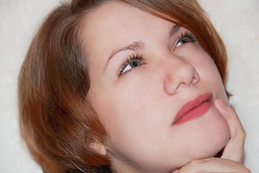 Portrait of beautiful girl with glance upwards