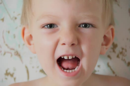 Portrait of cute boy with blue eyes