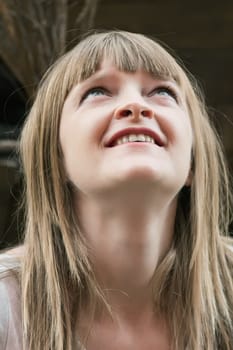 Image of beautiful blond woman looking upwards