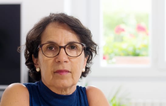 portrait of a beautiful mature woman with glasses