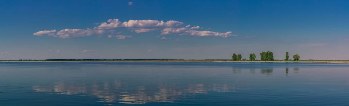 Relaxing water landscape with tree reflections