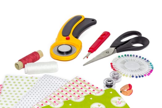Composition of instruments, items and fabrics for patchwork hobby
