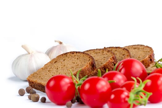 Set of bread, bunch of cherry tomatoes and garlic