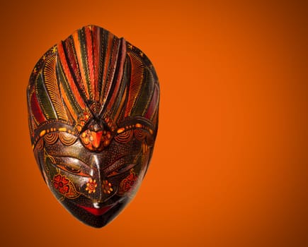 Traditional Indonesian mask, Baliness, on red background