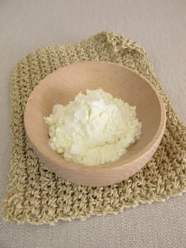 Milk powder in a small wooden bowl