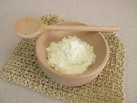 Milk powder in a small wooden bowl
