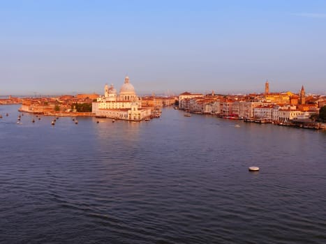 Beautiful view from Grand Canal on colorful facades of old medieval houses in Venice, Italy at sunset