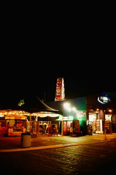 Los Angeles,United States - December 28,2015: The Santa Monica Pier amusement park with illuminated stalls and takeaways at night on December 28,2015 in Los Angeles.