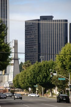 Los Angeles,United States - December 27,2015: Road traffic on Olympic Boulevard in downtown Los Angeles with various high-rise buildings on December 27,2015 in Los Angeles.