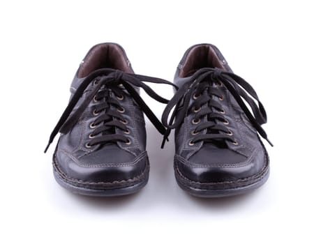 Black leather men's shoes on white background.