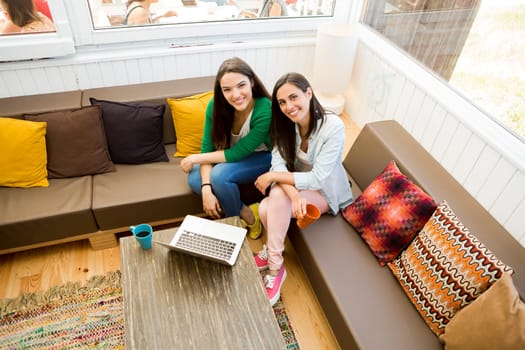 Female friends studying at the local coffee shop