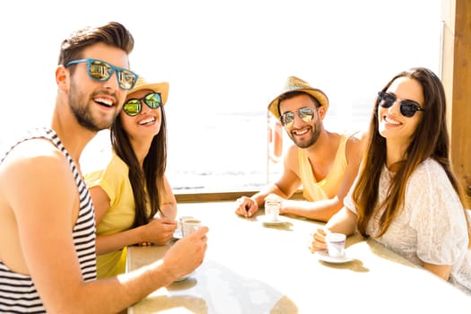 Fiends having a great time together at the beach bar