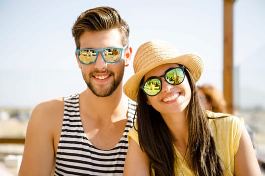 Fiends having a great time together at the beach bar