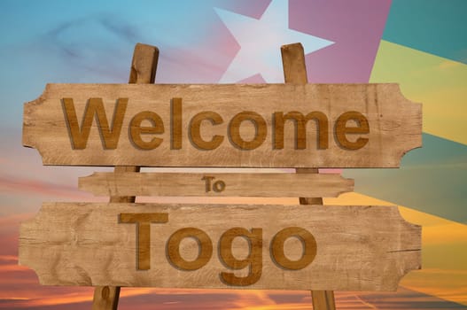 welcome to ecuador sing on wood background with blending national flag