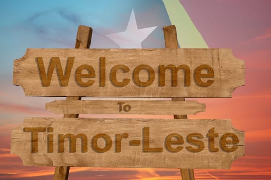 welcome to ecuador sing on wood background with blending national flag