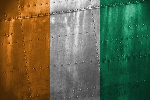 texutre or metal background with ivory coast flag