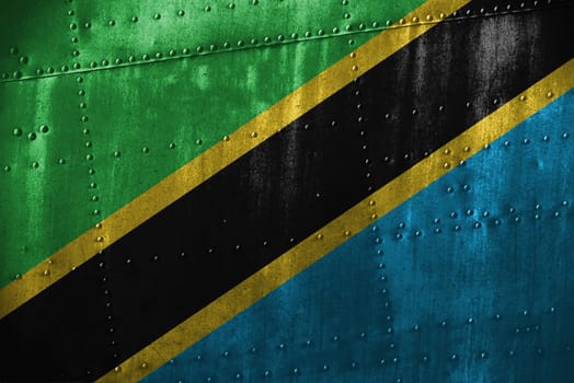 metal texutre or background with tanzania flag