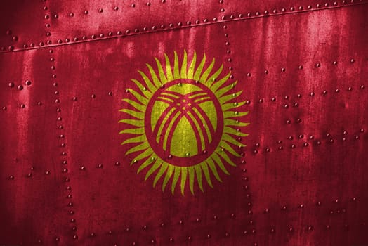metal texutre or background with kyrgyzstan flag
