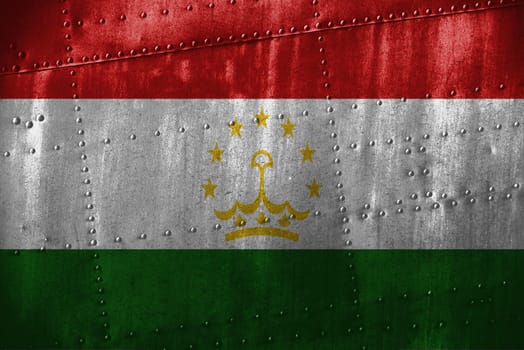 metal texutre or background with tajikistan flag