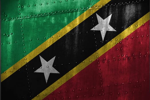 metal texutre or background with saint kitts & nevis flag