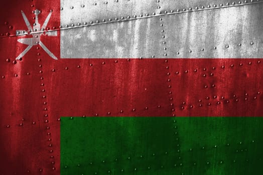 metal texutre or background with oman flag