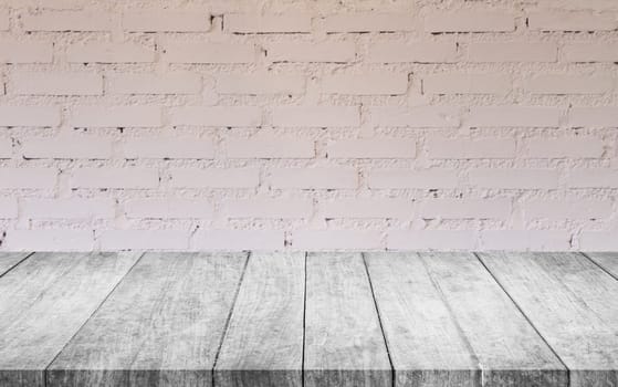 Black and white wooden table top with white brick wall decorated in coffee shop