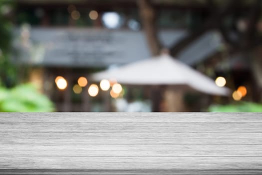 Top of black and white wooden table with cafe blurred abstract background