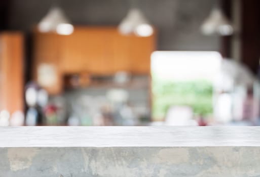 Concrete tabletop with abstract blur coffee shop background
