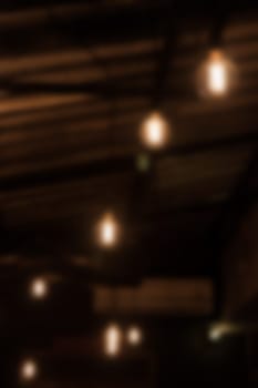 Warm lighting lamps on ceiling in coffee shop, stock photo