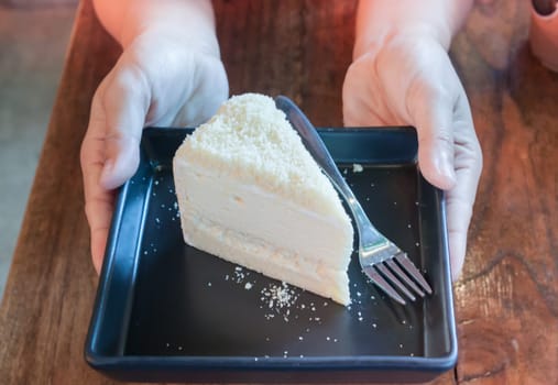 Closeup cheese cake on black plate, stock photo