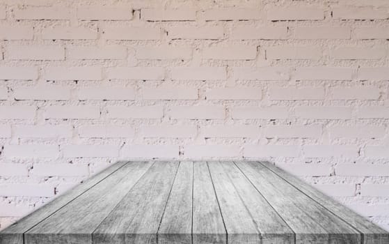 Perspective black and white wooden table top with brick wall decorated in coffee shop