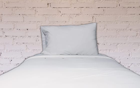 Single bed with white brick wall decorated in coffee shop