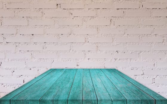 Perspective blue wooden table top with brick wall decorated in coffee shop