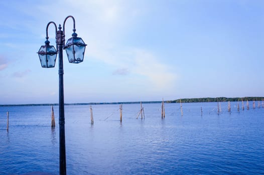 Light tower at sea in evening time