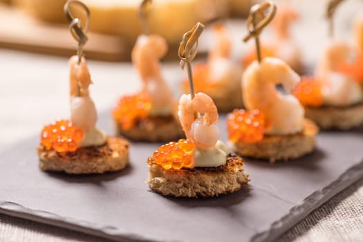 Shrimp Appetizer served on toasted bread with golden Caviar