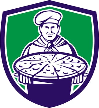 Illustration of a chef, cook baker serving pizza platter facing front set inside shield crest on isolated background done in retro style.