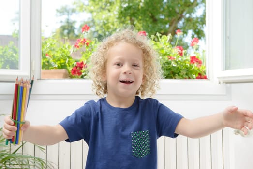 a blond boy is happy to go to school