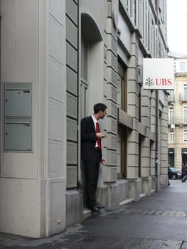Zurich, Switzerland - November 27, 2011. Office clerk went out to smoke