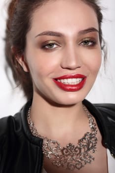 Face portrait of smiling woman. Teeth smiling girl. One model portrait on white background.