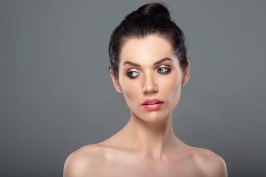 Portrait of woman with clean skin. Look down.