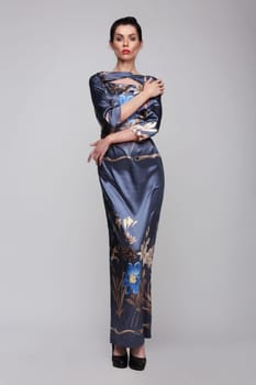 Female. Fashion. The long narrow silk dress.