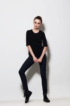 Young woman posing in the studio. Fashion. Clothing. Youth.