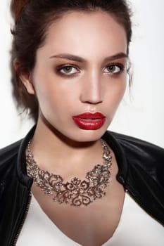 Portrait of young beautiful woman with fashion makeup. Fashion trend, red lips.
