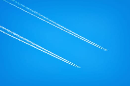 Two Jet Airplanes in the Blue Sky