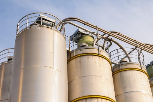 Detail of chemical plant, silos and pipes