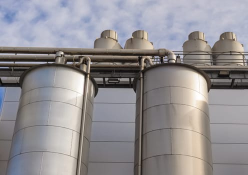 Detail of chemical plant, silos and pipes
