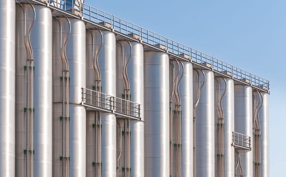 Detail of chemical plant, silos and pipes