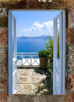 Beautiful sea view from the balcony. Oia town, Santorini island, Greece.