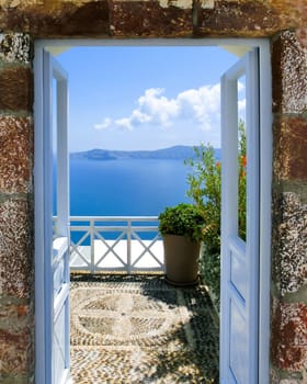 Beautiful sea view from the balcony. Oia town, Santorini island, Greece.