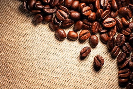 Coffee beans on the basis of goods close up.